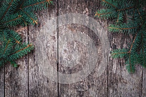 Christmas Fir branches on wooden background. Xmas and Happy New Year composition.