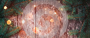 Christmas Fir branches on wooden background. Xmas and Happy New Year composition.