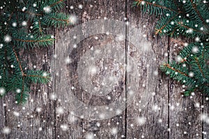 Christmas Fir branches on wooden background. Xmas and Happy New Year composition.