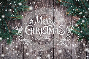 Christmas Fir branches on wooden background. Xmas and Happy New Year composition