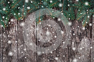 Christmas Fir branches on wooden background. Xmas and Happy New Year composition.