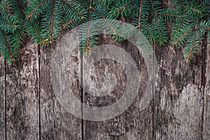 Christmas Fir branches on wooden background. Xmas and Happy New Year composition. Flat lay, top view