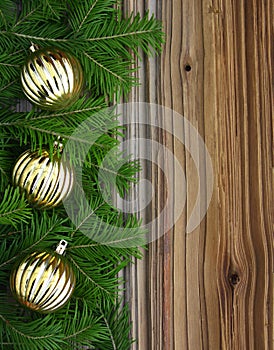 Christmas fir-tree with baubles on background