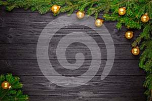 Christmas fir tree on black wooden background