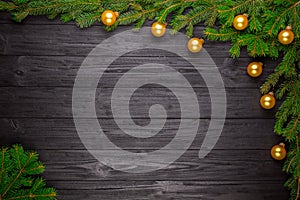 Christmas fir tree on black wooden background