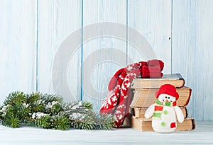 Christmas fir tree, books and snowman