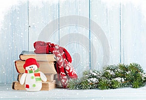 Christmas fir tree, books and snowman
