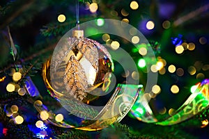 Christmas fir tree with decoration on a dark background with bokeh lights