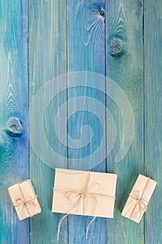 Christmas fir tree with decoration on dark wooden board. Snowflakes border on grunge wooden background. Winter holidays concept.