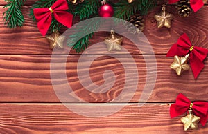 Christmas fir tree with decoration on dark wooden board. Soft focus.