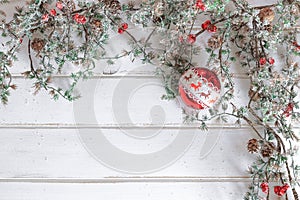 Christmas fir tree with decoration on white wooden board