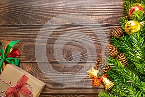 Christmas fir tree, festive. Composition decorations and xmas gift boxes on dark wooden board background. Celebration for holiday