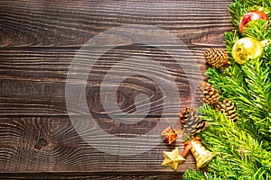 Christmas fir tree, festive. Composition decorations, xmas gift boxes on dark wooden board background. Celebration for holiday con