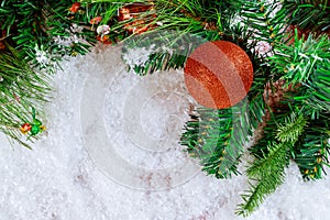 Christmas fir tree snow with branch pine cone, snowflakes on decoration ball