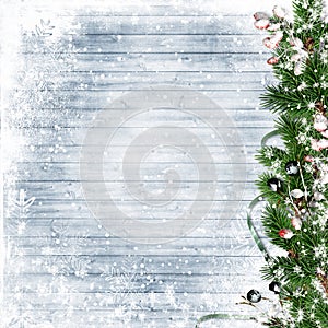 Christmas firtree with holly, snowfall on wooden white board