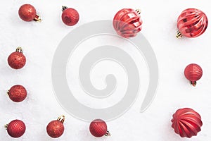 Christmas flat lay decoration frame on a white background. Red baubles with copy space