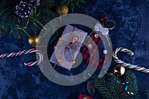 christmas flat lay with new year decorations on an abstract background with gifts and lollipops