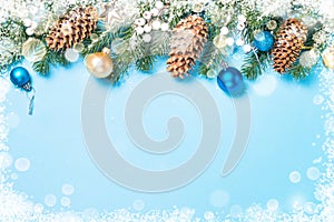 Christmas flatlay background - fir tree and decorations on blue