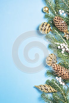 Christmas flatlay background - fir tree and decorations on blue