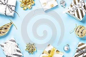 Christmas flatlay background - silver and gold decorations on bl