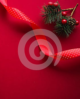 Christmas flatlay and holiday design concept. Decoration, ornament and xmas gift wrapping on red paper background as