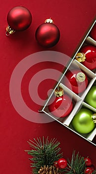 Christmas flatlay and holiday design concept. Decoration, ornament and xmas gift wrapping on red paper background as