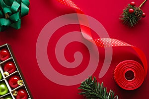 Christmas flatlay and holiday design concept. Decoration, ornament and xmas gift wrapping on red paper background as