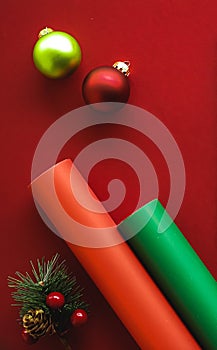 Christmas flatlay and holiday design concept. Decoration, ornament and xmas gift wrapping on red paper background as