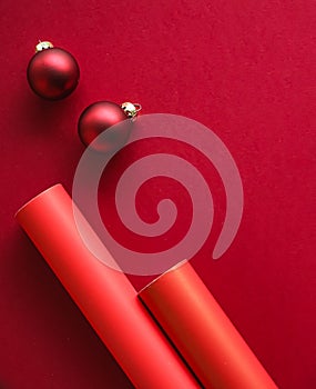 Christmas flatlay and holiday design concept. Decoration, ornament and xmas gift wrapping on red paper background as