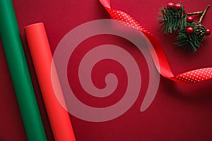 Christmas flatlay and holiday design concept. Decoration, ornament and xmas gift wrapping on red paper background as