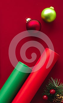 Christmas flatlay and holiday design concept. Decoration, ornament and xmas gift wrapping on red paper background as