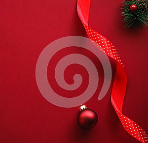 Christmas flatlay and holiday design concept. Decoration, ornament and xmas gift wrapping on red paper background as