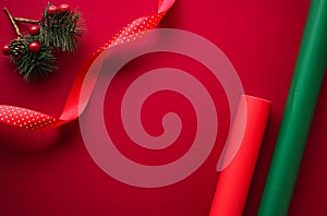 Christmas flatlay and holiday design concept. Decoration, ornament and xmas gift wrapping on red paper background as