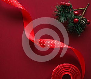 Christmas flatlay and holiday design concept. Decoration, ornament and xmas gift wrapping on red paper background as