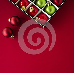 Christmas flatlay and holiday design concept. Decoration, ornament and xmas gift wrapping on red paper background as