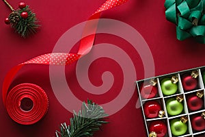 Christmas flatlay and holiday design concept. Decoration, ornament and xmas gift wrapping on red paper background as