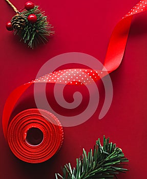 Christmas flatlay and holiday design concept. Decoration, ornament and xmas gift wrapping on red paper background as