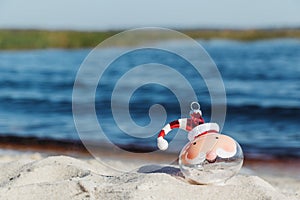 Christmas in Florida concept, santa ornament on beach