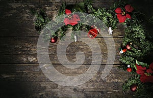 Christmas flowers and pine on weathered wood
