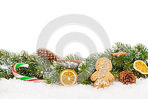 Christmas food and decor over snow fir tree