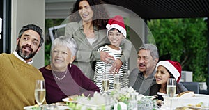 Christmas, food and a family selfie together at a table for a social gathering, celebration event or bonding. Children
