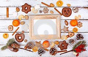 Christmas food flat lay with photo frame on white table
