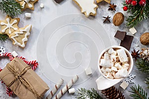 Christmas frame. A cup of hot chocolate and gingerbread, Christmas gifts on the table.