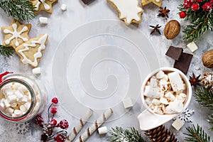 Christmas frame. A cup of hot chocolate and gingerbread, Christmas gifts on the table.