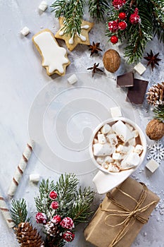 Christmas frame. A cup of hot chocolate and gingerbread, Christmas gifts on the table.