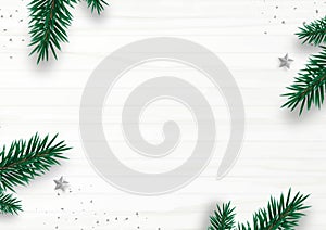 Christmas frame decor with fir tree branch, stars, confetti, isolated on white wooden background. Flat lay. Top view. Copy space.