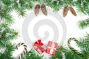 Christmas Frame of Fir tree branch with snow isolated on white background with copy space for your text. Top view