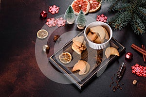 Christmas frame with fir tree branches, gingerbread cookies, spices and dried orange rings