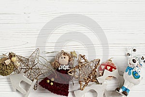 Christmas frame of golden toys. ornament border on white rustic