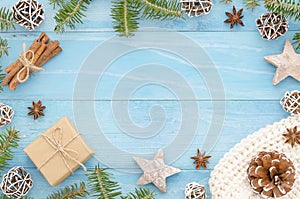 Christmas frame rustic blue wooden background christmas tree, cinnamone,anice star, pine cones and fir tree. Winter photo
